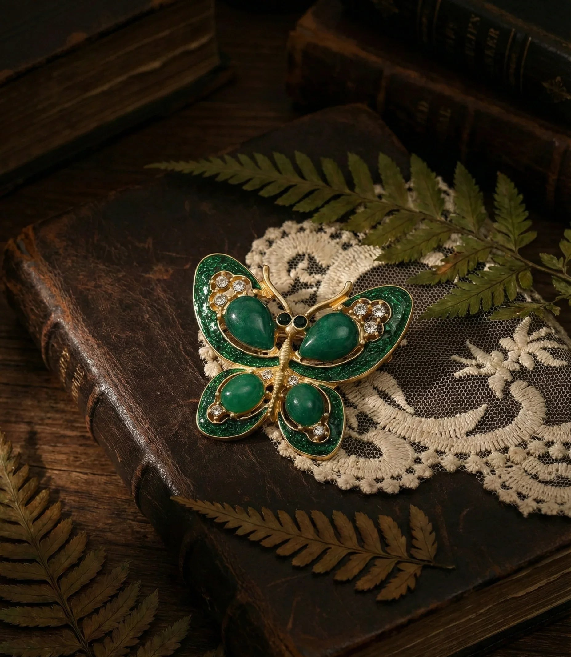 Botanical Gothic emerald green butterfly brooch in gold-tone plating with gemstone accents, statement pin 4.3 x 5.0 cm
