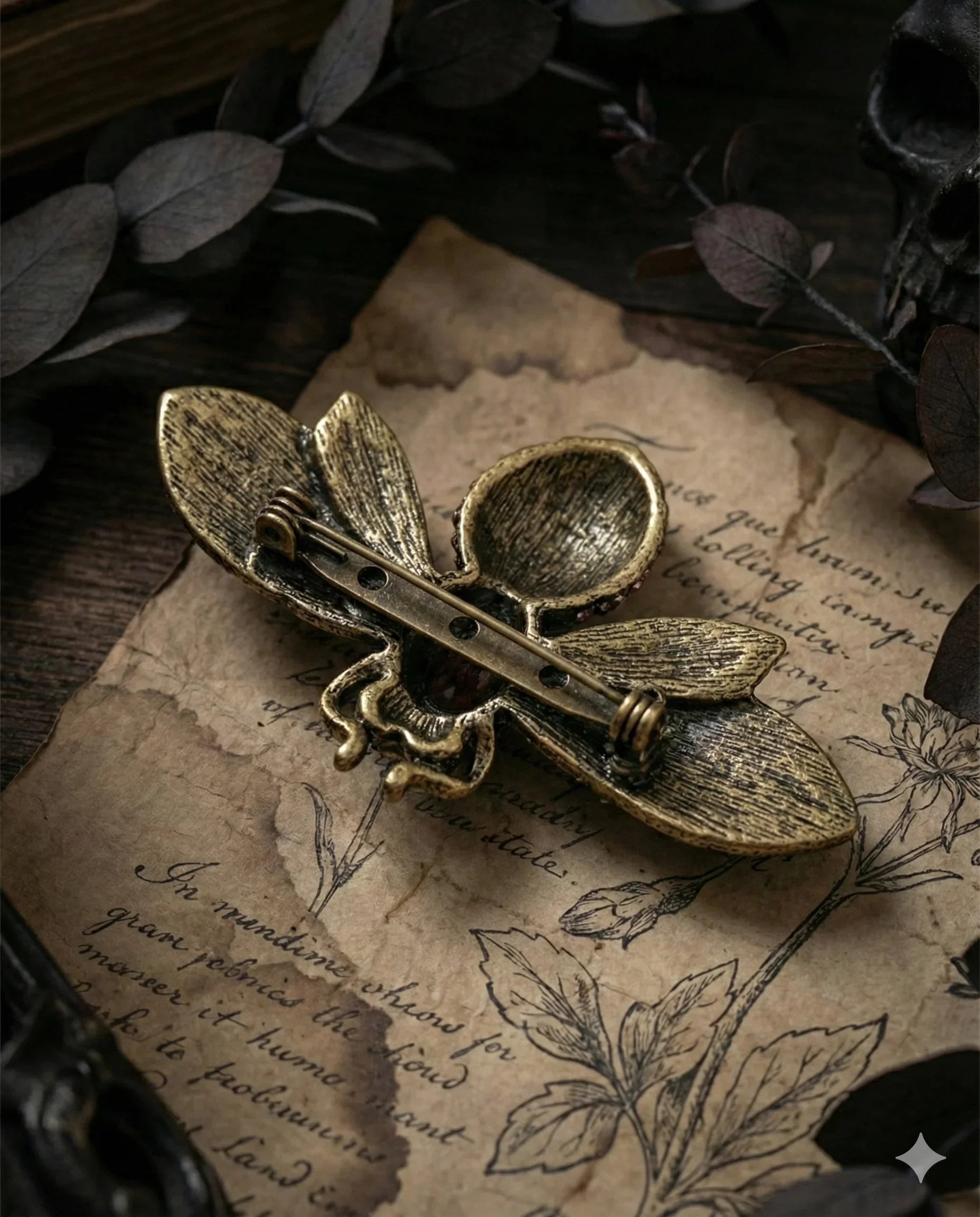 Botanical Gothic crystal bee brooch in antique gold tone with purple and iridescent rhinestones, statement pin