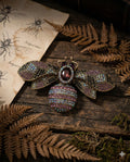 Botanical Gothic crystal bee brooch in antique gold tone with purple and iridescent rhinestones, statement pin